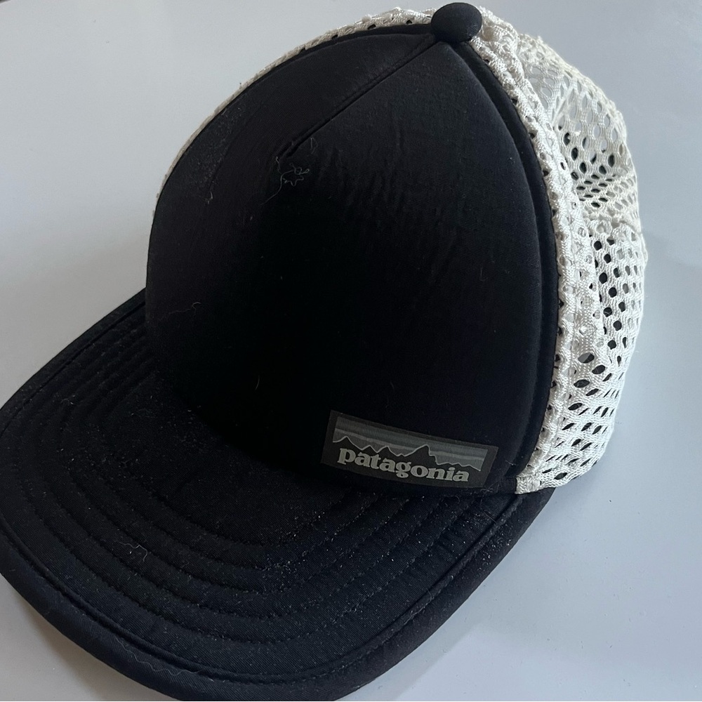 Patagonia mesh back foam trucker hat reflective font on front of hat